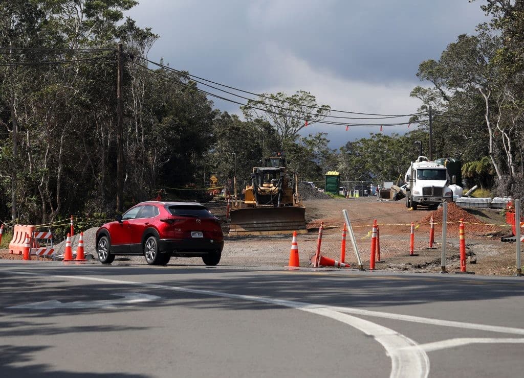Car parked near bulldozer