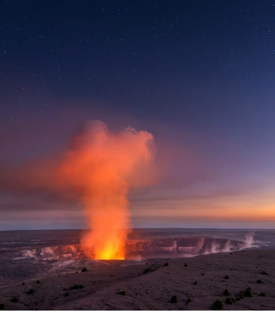 Red glow of lava in volcanic crater at Volcanoes National Park Red glow of lava in volcanic crater at Volcanoes National Park