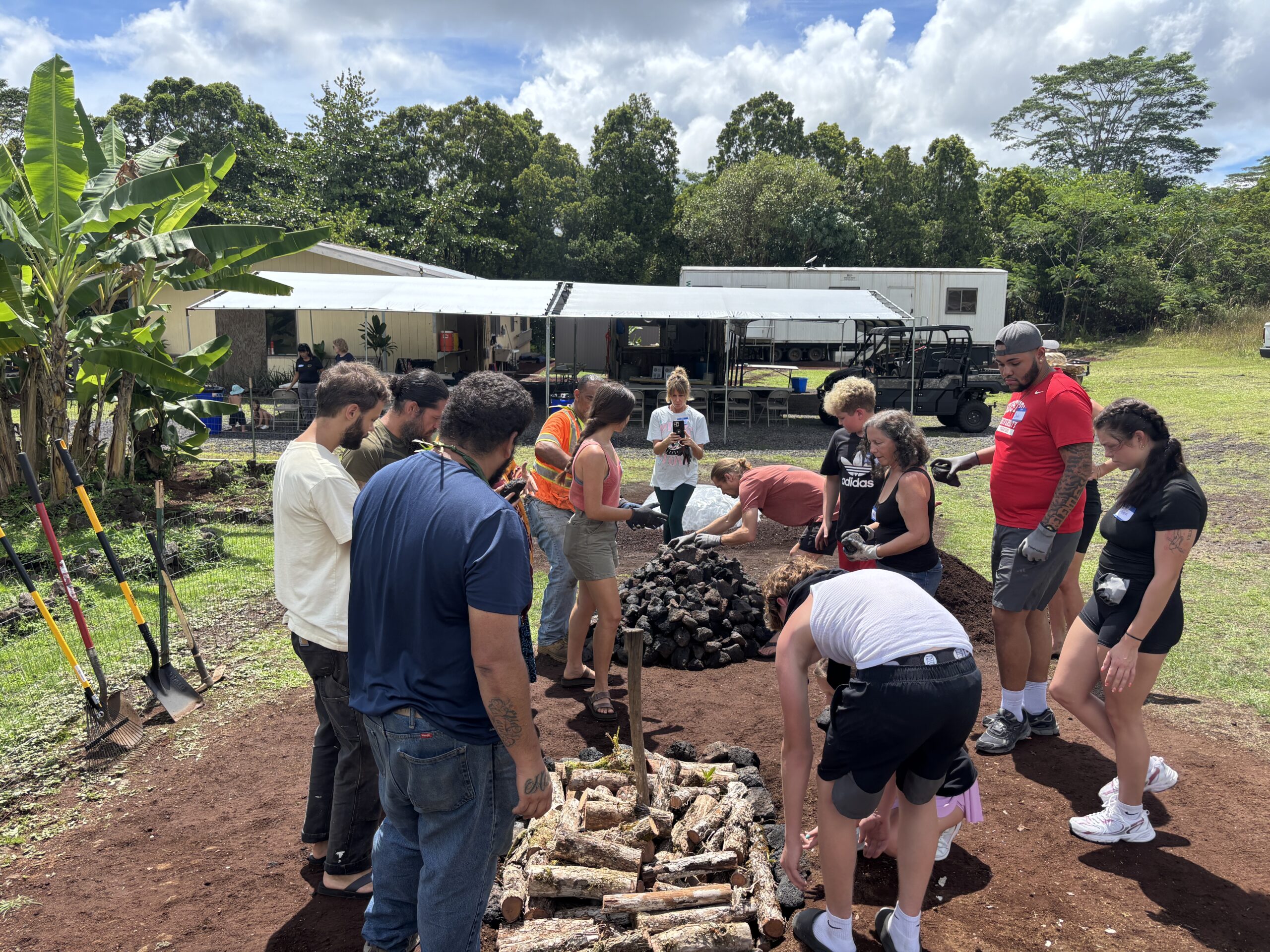 people building an imu or underground oven