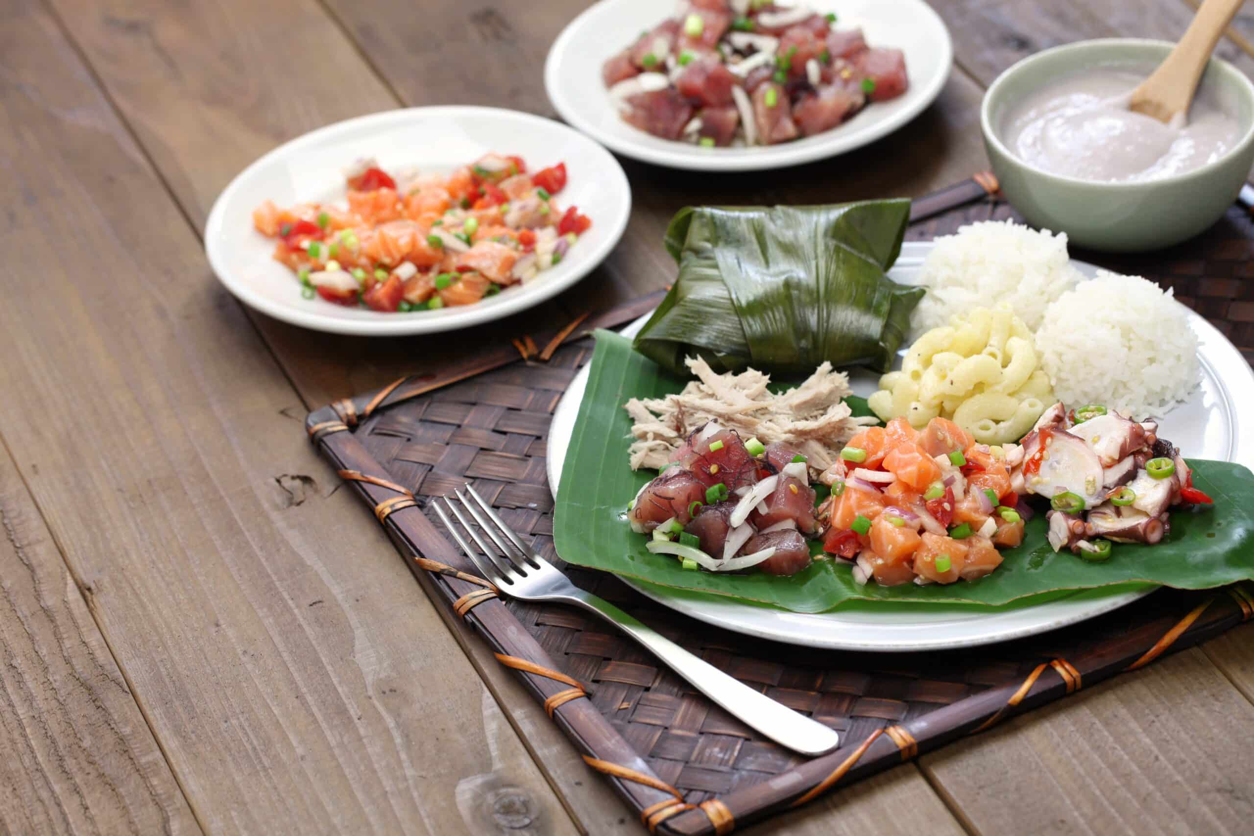Traditional plate lunch: ahi poke,lomi lomi salmon,tako poke,kalua pork,poi,lau lau. Photo by Shutterstock.