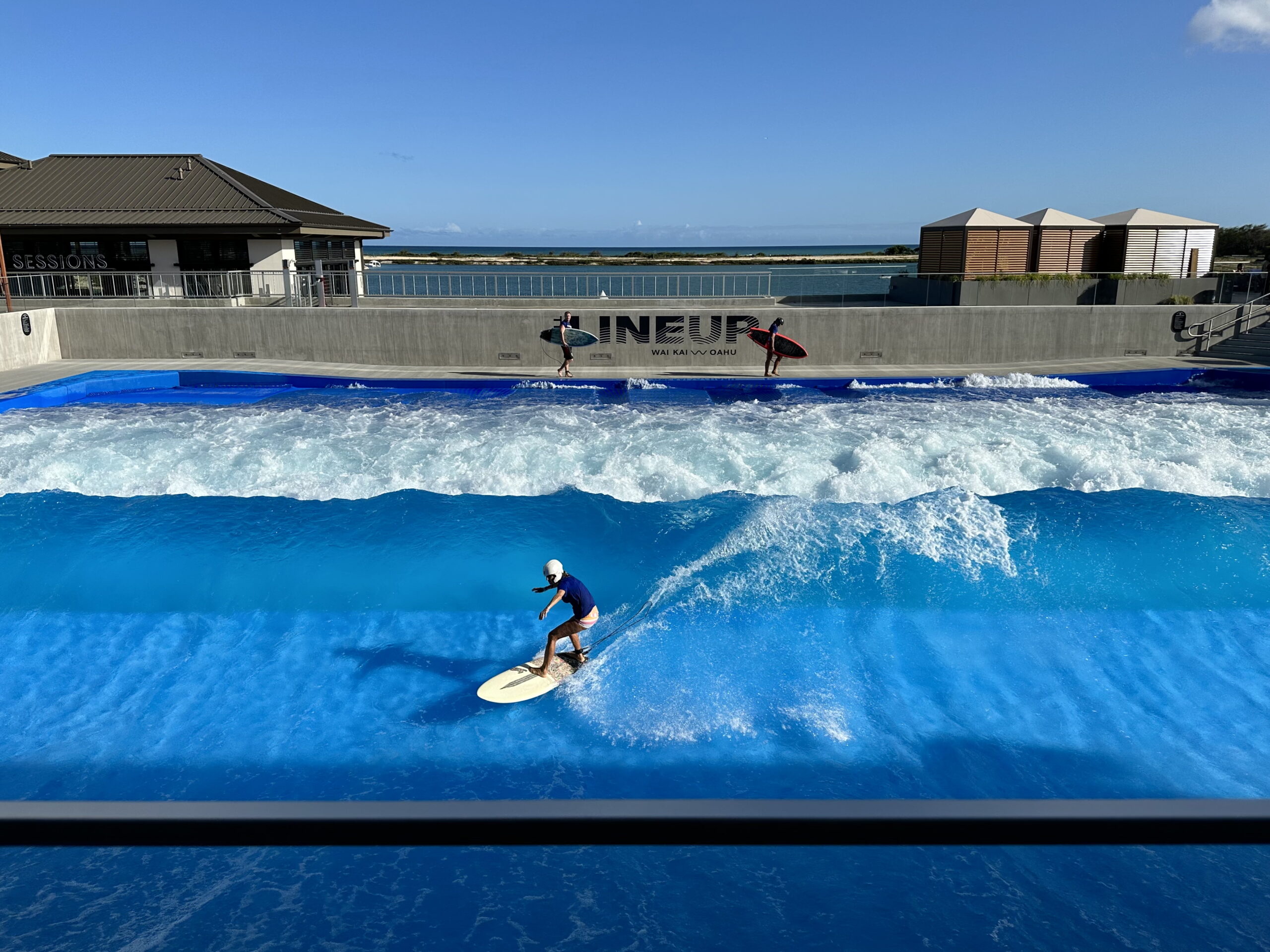 Boy surfing in pool at LineUp at Wai Kai in Ewa Beach on Oahu Hawaii.